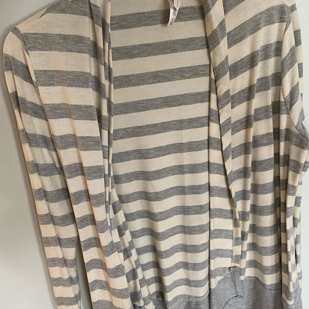 Grey and White sweater.